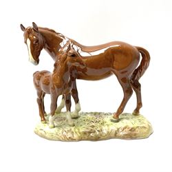 A Beswick model of a chestnut mare and f