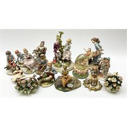 Collection of Capodimonte and Naples figures, including boy with telephone, boy and girl by a tree, man on rocking horse etc.  