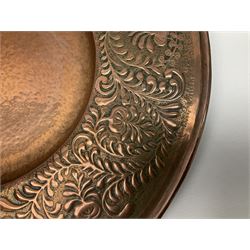 Arts and Crafts Keswick School of Industrial Arts copper charger, decorated with planished centre and repousse scrolling foliate tendrils to rim, D44cm