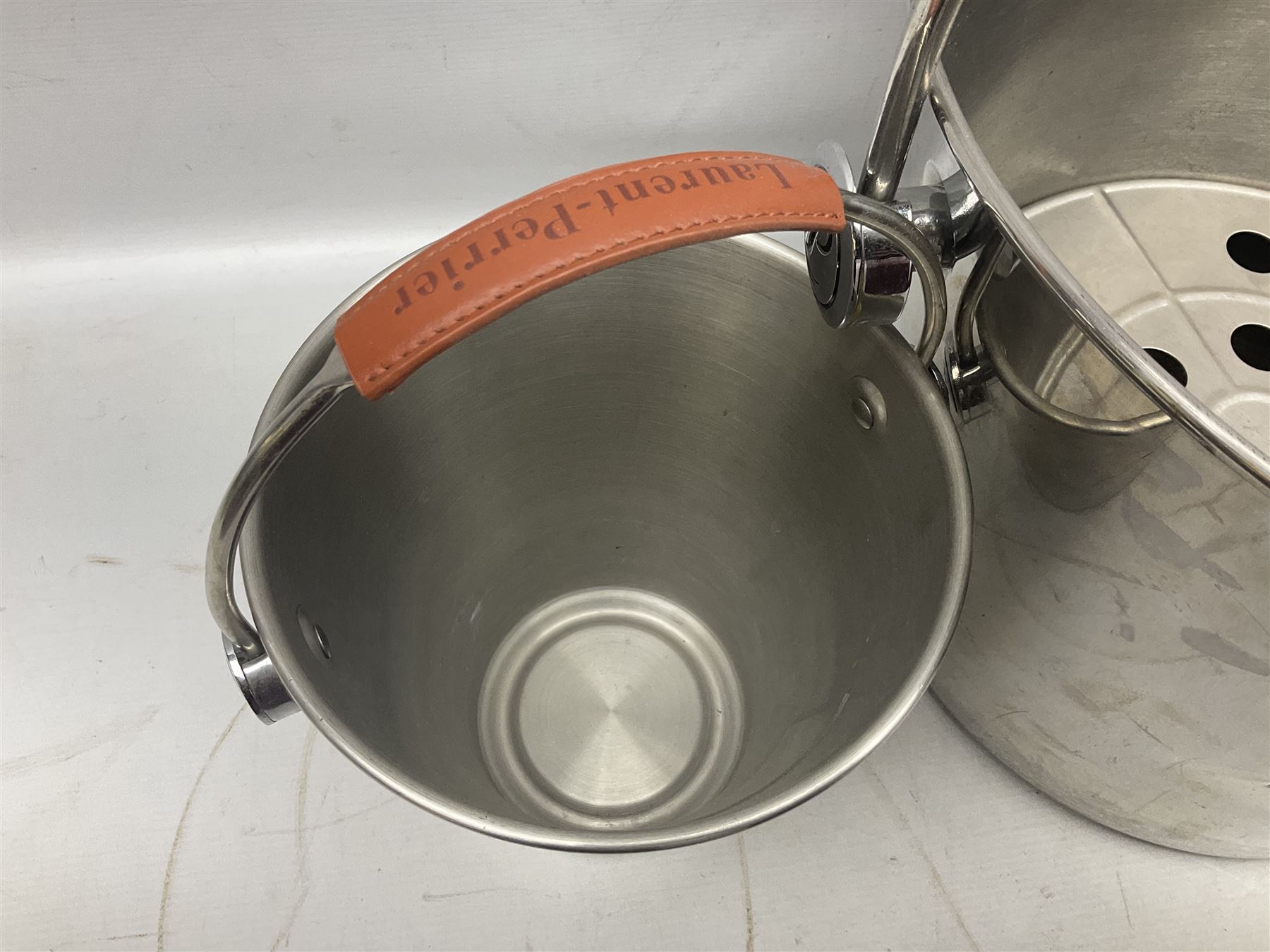 Stainless steel Laurent-Perrier champagne bucket, with engraved brass plaque and grip to swing handle, together with three matching smaller, largest D38cm (4)