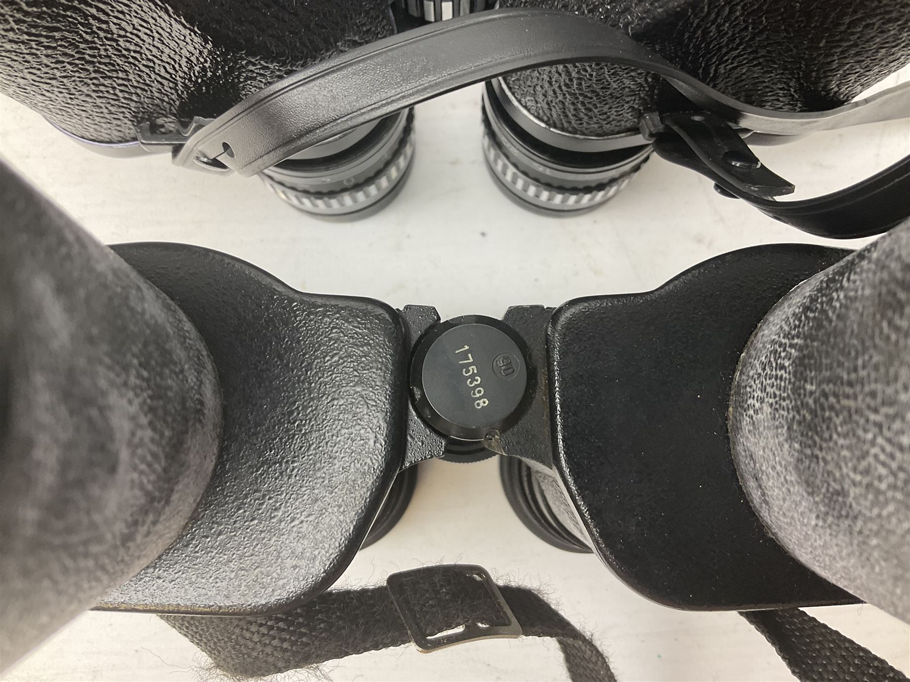 Nine cased pairs of binoculars to include Lieberman & Gortz 12x50, Frank Nipole 8x56, Uniscope, Hoya mark II 8x40, Porst 8x56 etc