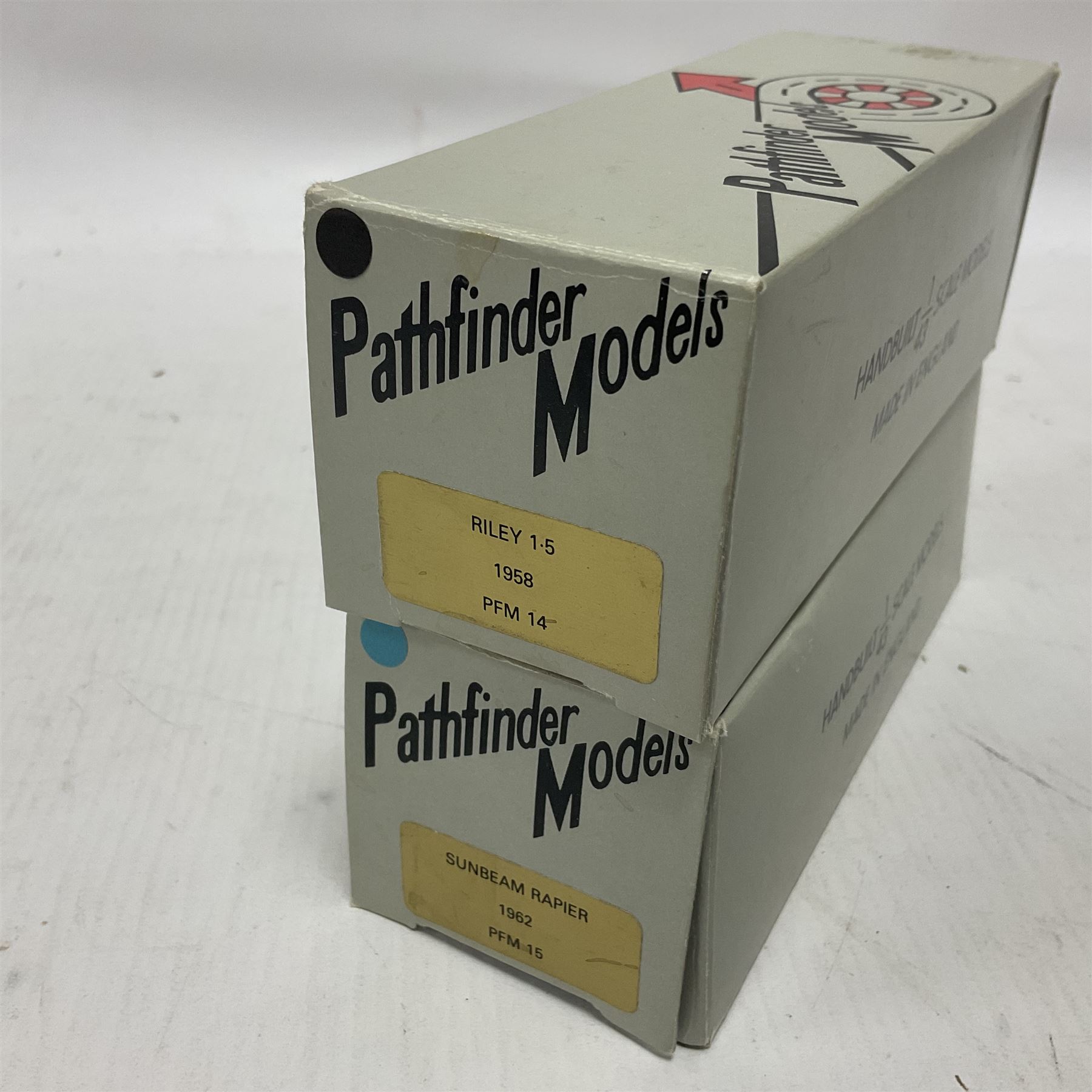 Pathfinder Models - two 1:43 scale model cars comprising Riley 1.5 1958 PFM14 with certificate of authenticity no.571/600 and Sunbeam Rapier 1962 PFM15; both in original boxes  