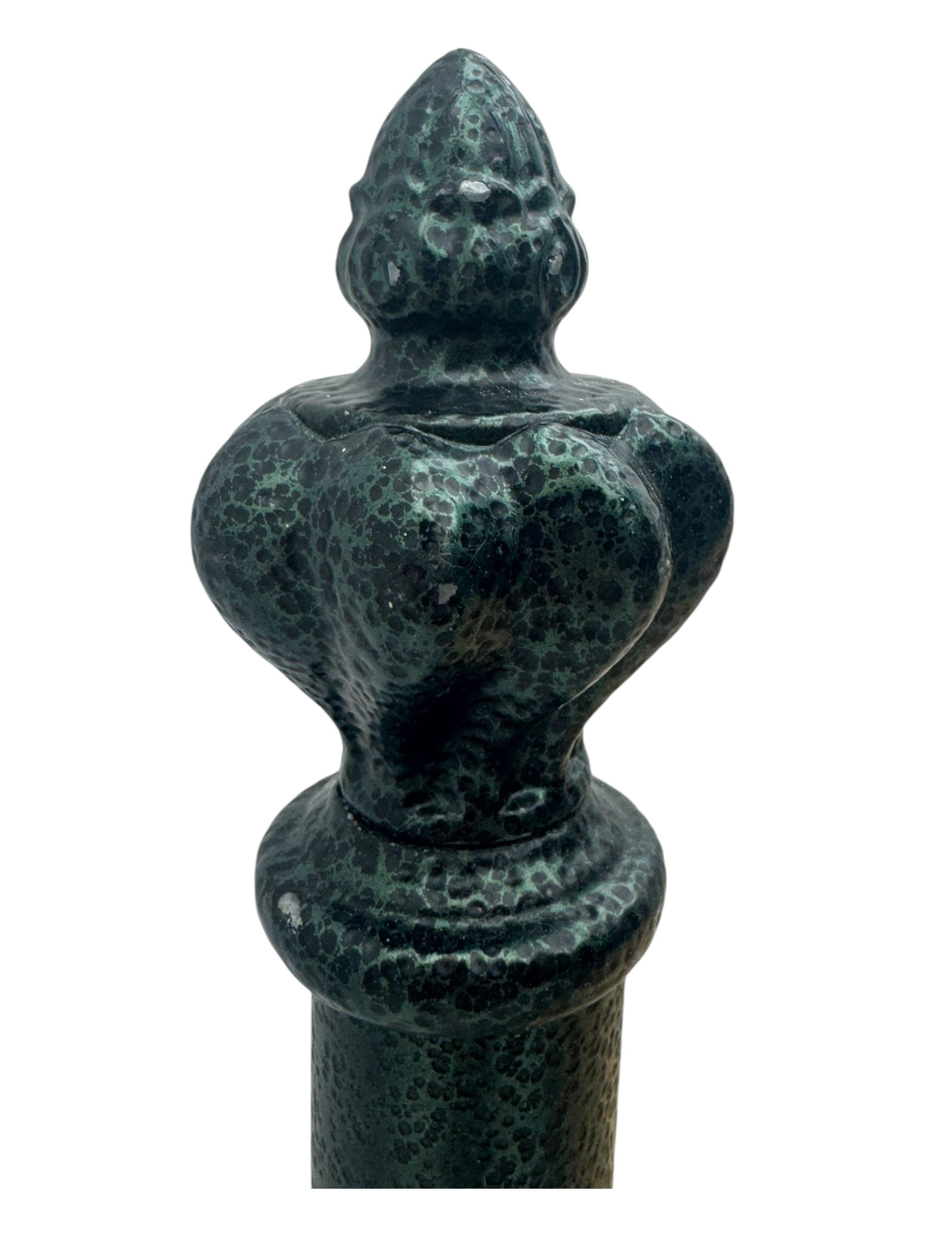 Contemporary metal double bed frame, shaped head and footboards with foliate cast panels and vertical rod supports, the corner posts with urn-shaped finials, finished in a mottled verdigris-style green, with pine slatted base