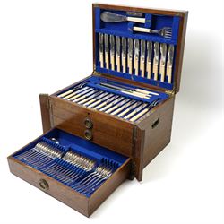 Suite of plated table cutlery for twelve covers including fish cutlery and servers, fruit knives and forks with mother of pearl handles, bone handled knives, carvers etc in an oak  three drawer cabinet with hinged lid W47cm 160 pieces