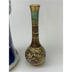 Japanese Meiji period miniature Satsuma bottle vase, painted with panels of figures below a green ground neck, H10cm together with a 19th/early 20th century Chinese blue and white Gu vase, painted with prunus flowers and bearing four character Kangxi mark to base, H25.5cm (2)