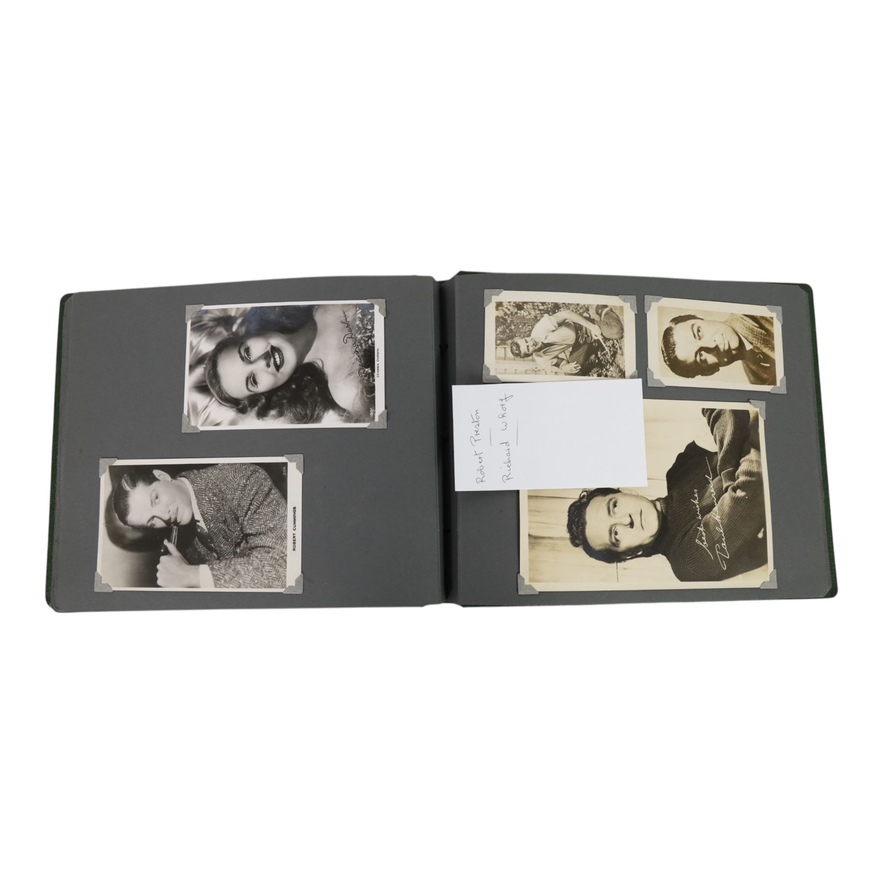 Collection of photographs and postcards, mostly depicting 1940s film stars, including some autographed examples and some with printed signatures, together with a collection of Shirley Temple  promotional photographs,1930s autograph album and postcards of the Royal Family