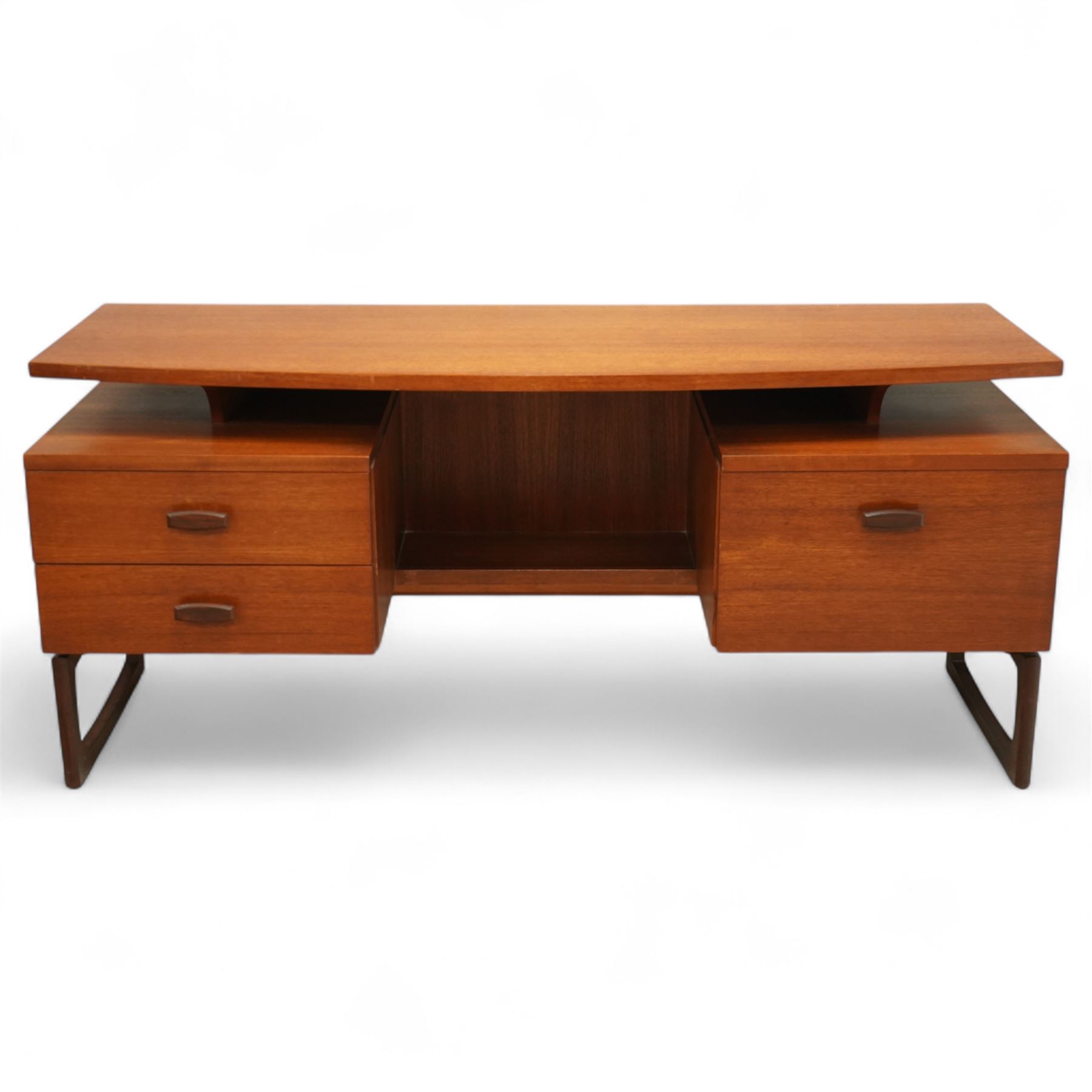 R Bennett for G Plan - mid-20th century teak 'Quadrille' desk or dressing table,  shaped platform rectangular top above rectilinear open base above four drawers with sculpted handles, on rectangular frame supports 