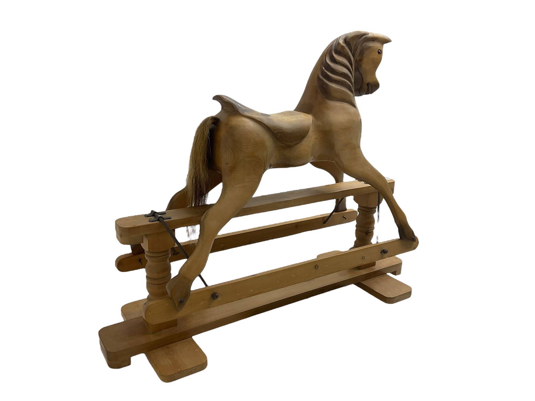 Terry White for White Horses (Hertfordshire 20th century) - Carved pine rocking horse, raised on a pine trestle base