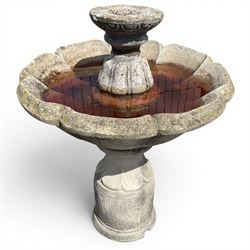 Weathered cast stone garden water feature fountain, the raised central spout with egg-and-...