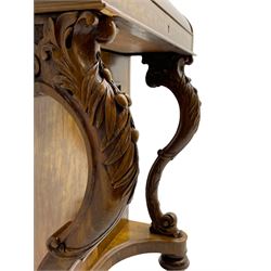 Fine and unusual 19th century olivewood piano top davenport, raised shaped back carved with olive branches and olives, the top hinges to reveal lidded and correspondence compartments, the piano lid enclosing sliding top with hinged and adjustable writing surface with leather inset, right-hand panelled door enclosing four drawers, olive branch and scroll carved cabriole front supports on moulded and shaped platform, turned cup feet with recessed castors 