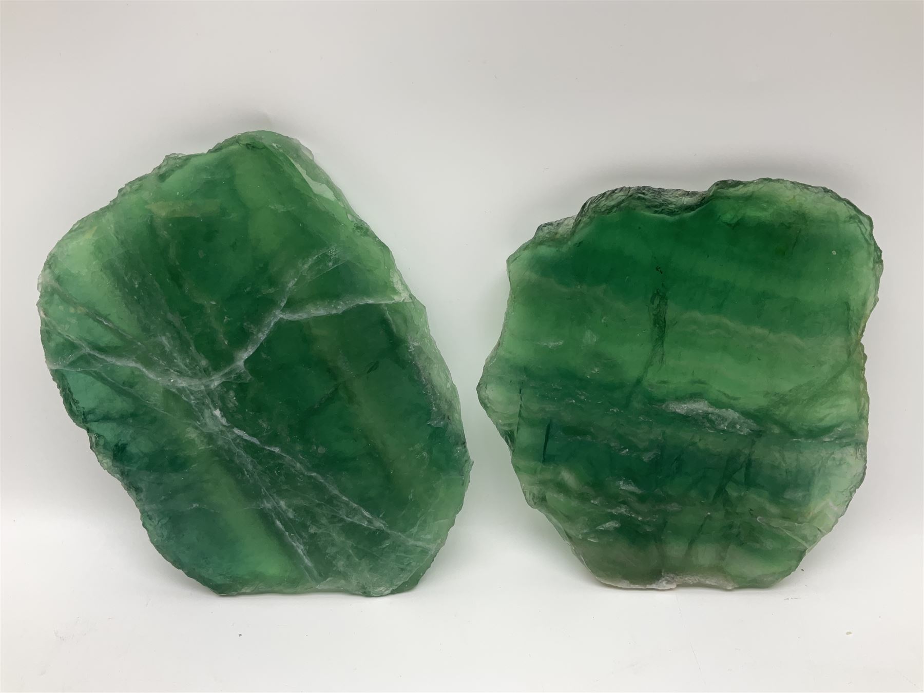 Pair of green fluorite slices, polished with rough edges, H16cm, L17cm  
