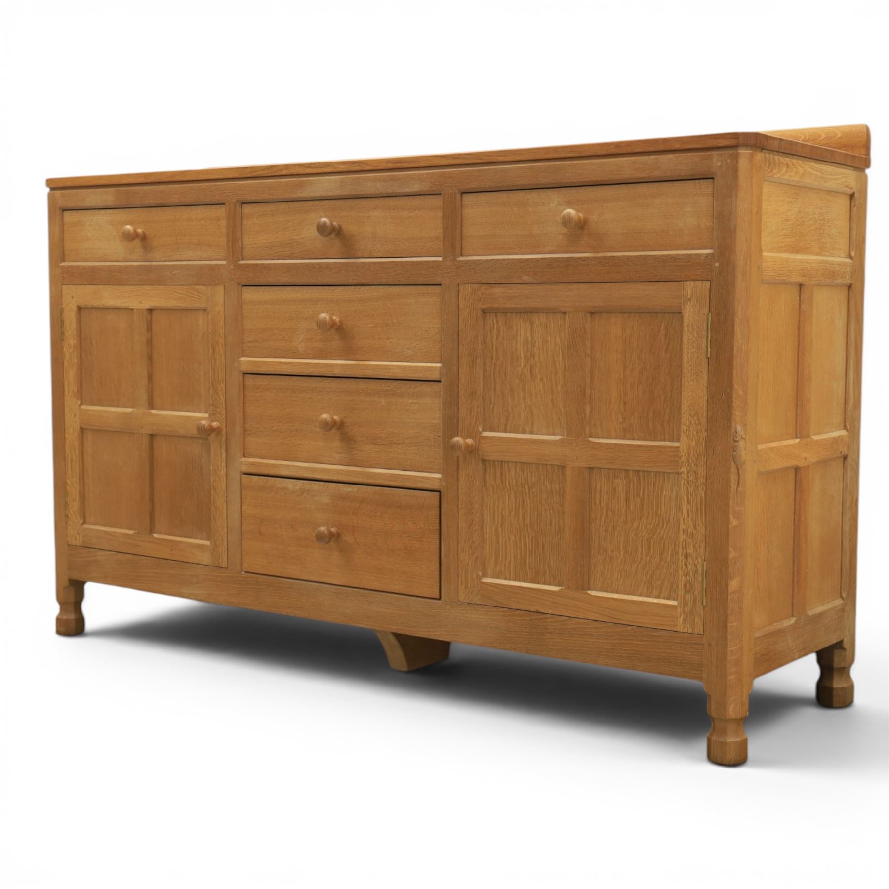 Mouseman - adzed oak dresser, fitted with six drawer and two cupboards, with carved mouse signature, by the workshop of Robert Thompson of Kilburn