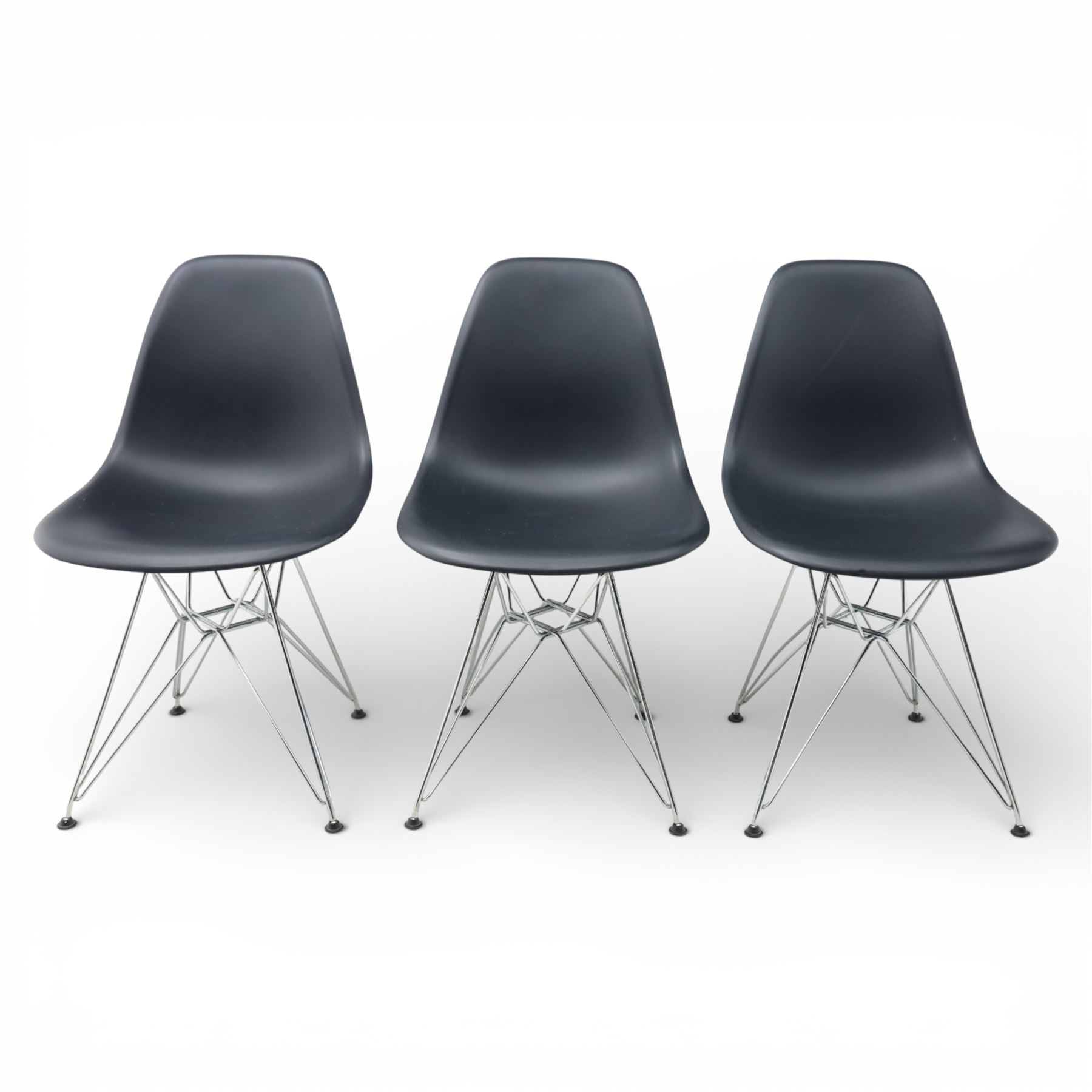 Vitra - set of six DSR side chairs designed by Charles and Ray Eames, moulded black plastic seats, raised on chromed wire Eiffel bases with plastic foot glides