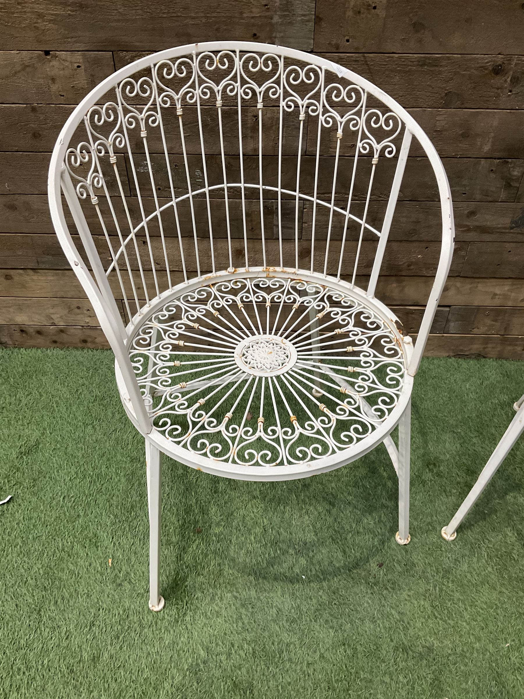 Pair of wrought metal white painted wirework garden chairs - THIS LOT IS TO BE COLLECTED BY APPOINTMENT FROM DUGGLEBY STORAGE, GREAT HILL, EASTFIELD, SCARBOROUGH, YO11 3TX