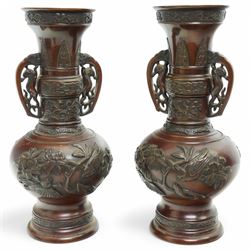 Pair of Japanese two-handled bronze vases, of baluster form with elongated neck, decorated...