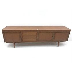  Mid century teak sideboard, three cupboards and three drawers, turned tapering supports, W229cm, H73cm, D43cm  