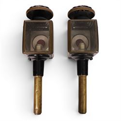 Pair of brass and toleware carriage lamps, the traditional chimney over a rectangular form...