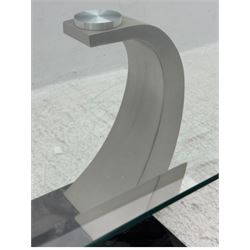 Contemporary coffee table, rectangular clear glass top over brushed stainless steel curved supports, mounted on a rectangular base