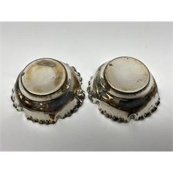 Pair of Victorian silver open salts, of circular form with shaped rims and matching salt spoons, all hallmarked, within fitted tooled leather case 