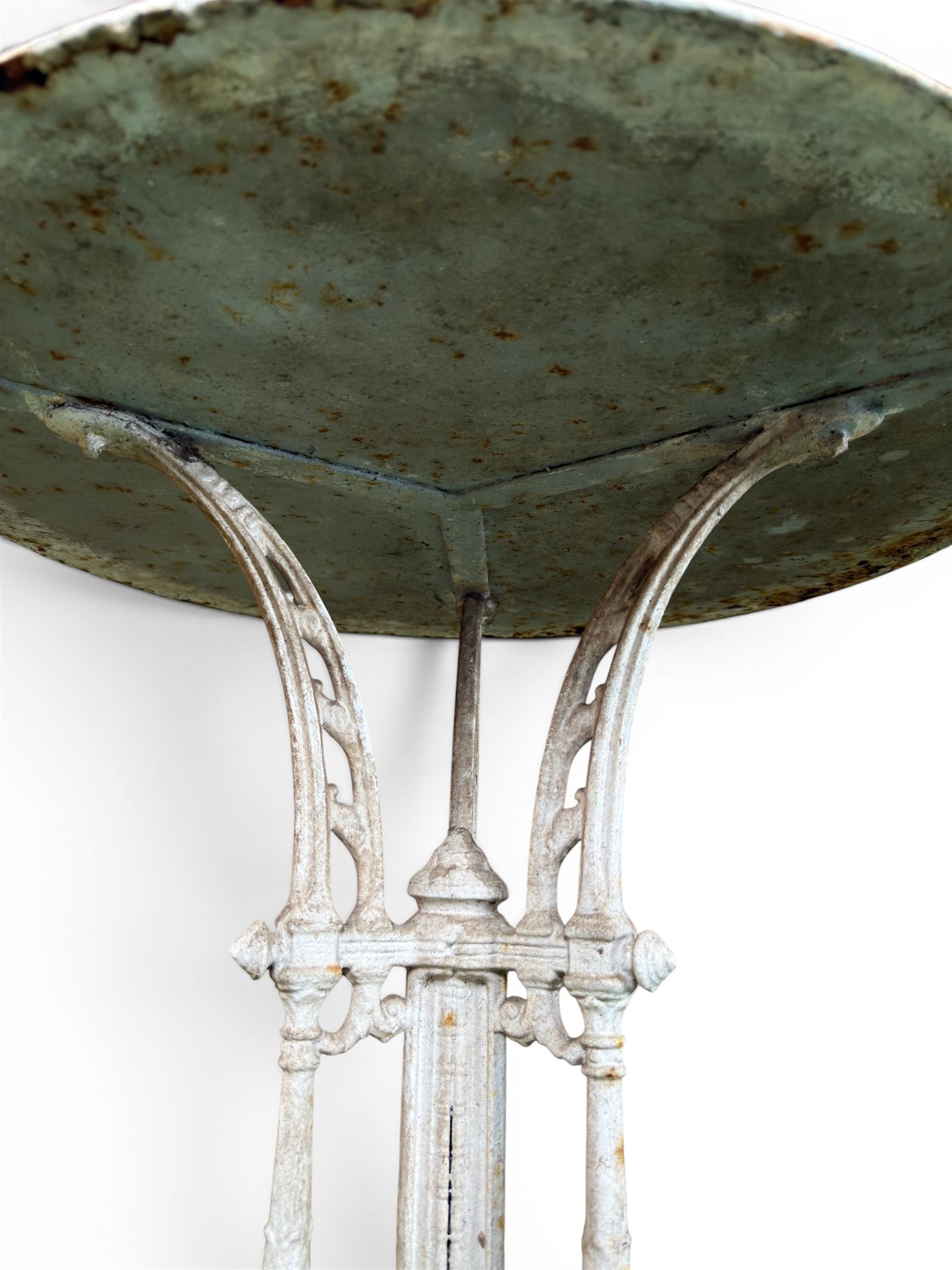 Victorian ornate cast iron garden table, trefoil base with central enclosed column, circular top with later marble, with registration mark