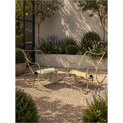 Pair of white painted cast metal garden chairs, ornate reclined backs, circular pierced se...