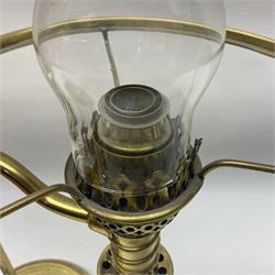 Brass adjustable student's oil lamp, with yellow glass shade, H52cm