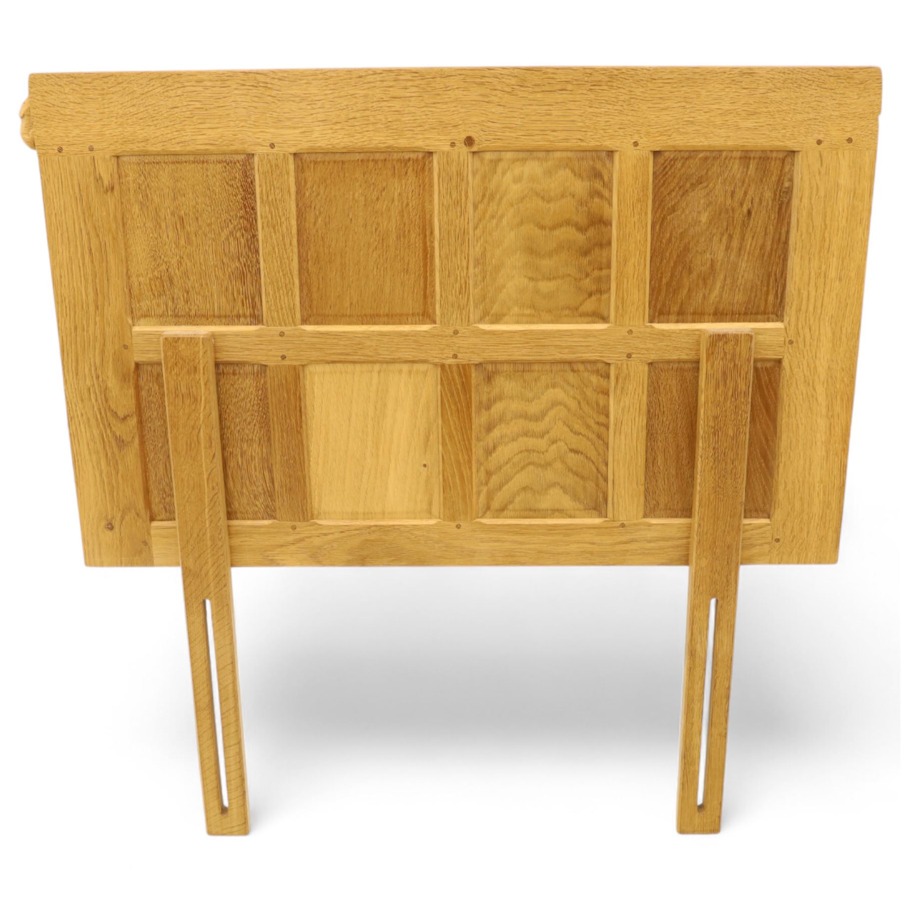 Mouseman - single bed oak headboard, comprising eight vertical fielded panels beneath a shaped and scalloped top rail, carved with the signature mouse motif, by the workshop of Robert Thompson, Kilburn 