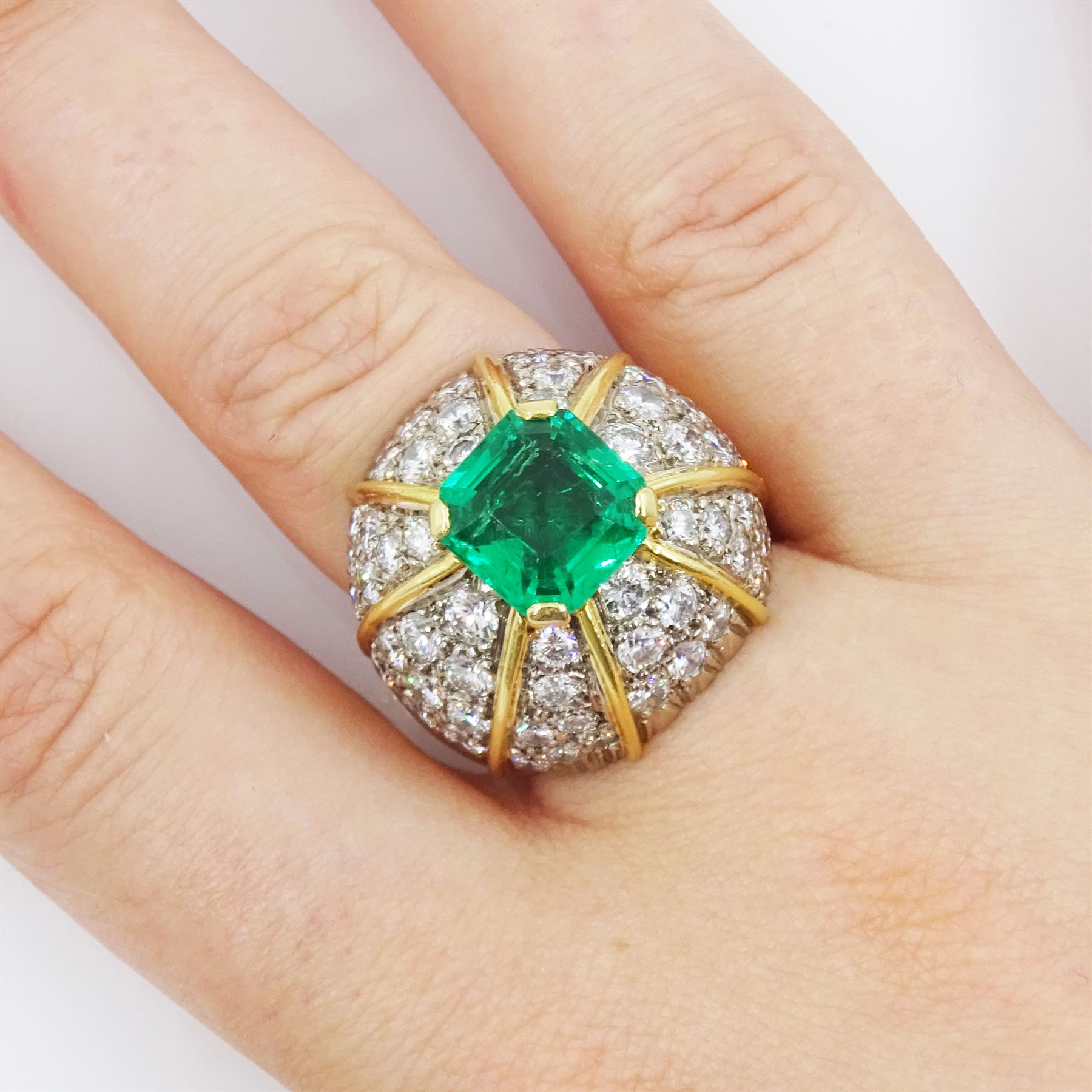 18ct white and yellow gold emerald and diamond dome ring, octagonal cut emerald, surrounded by eight sections of pave set round brilliant cut diamonds, emerald approx 3.65 carat, total diamond weight approx 4.00 carat