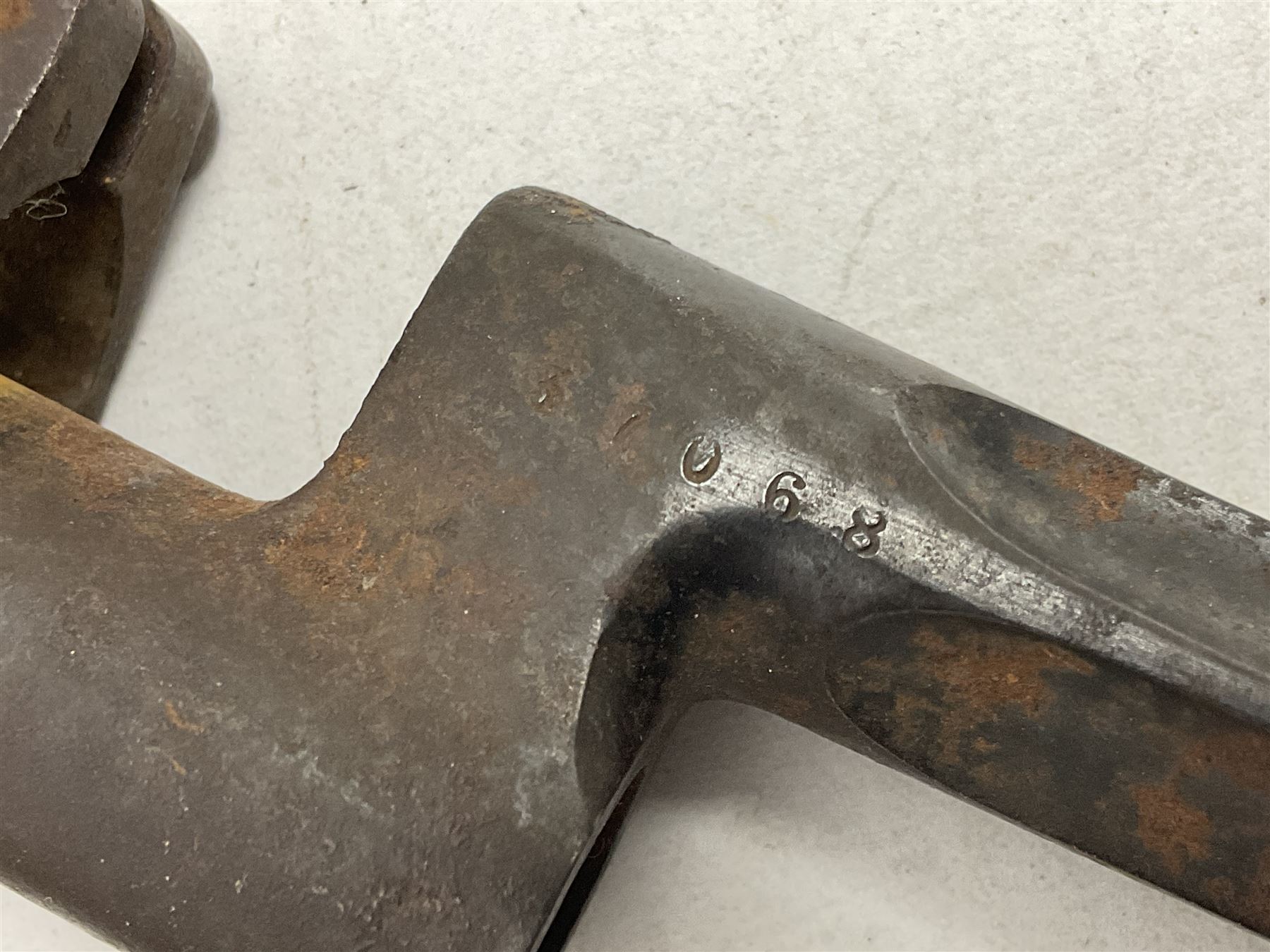 French model 1866 sabre bayonet, the 57.5cm curving blade marked St. Etienne 1873; in associated steel scabbard L71cm; and Mosin-Nagant M1891 socket bayonet with 43cm cruciform blade No.37068 (no scabbard) (2)