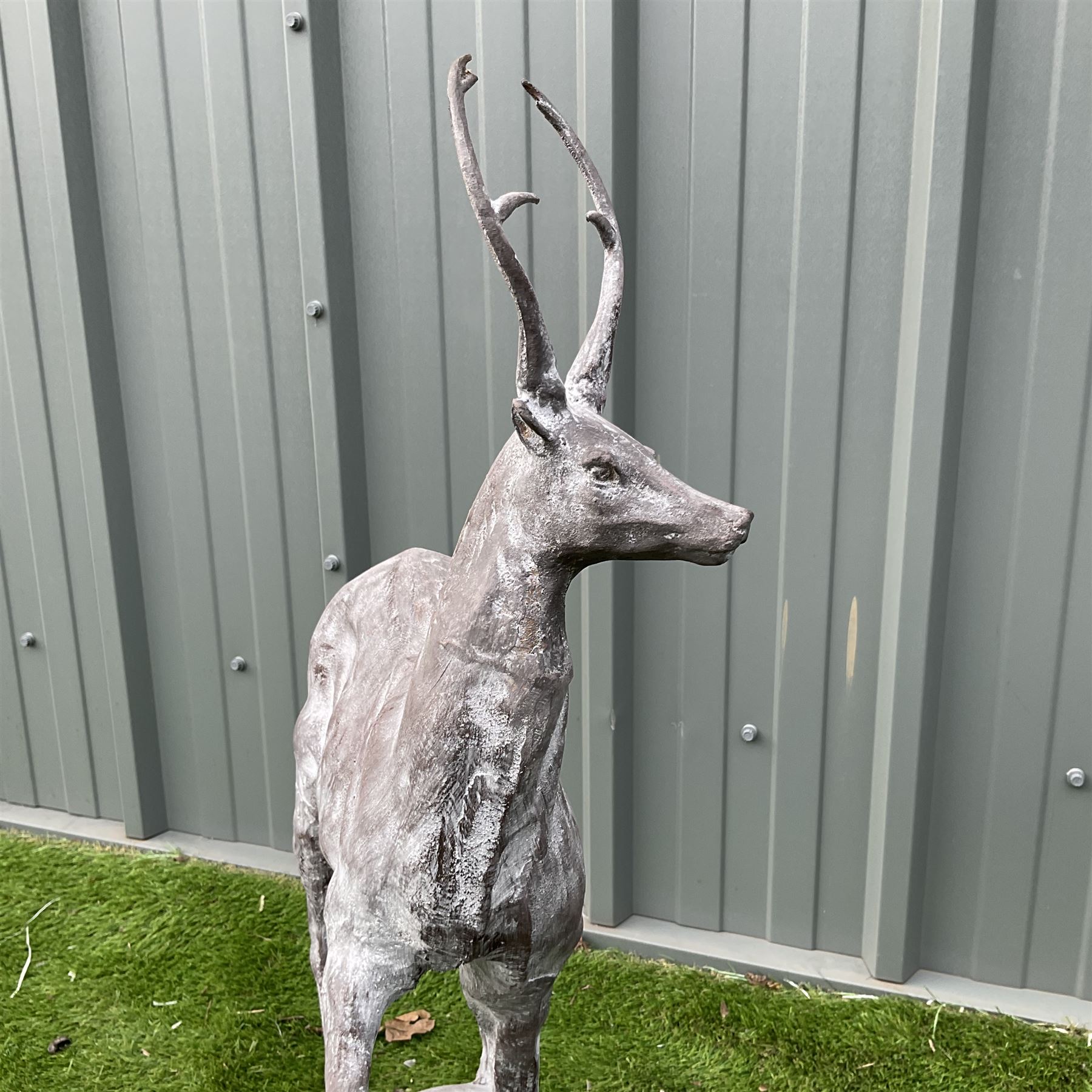 A pair of cast iron garden stag finials on ball bases - THIS LOT IS TO BE COLLECTED BY APPOINTMENT FROM DUGGLEBY STORAGE, GREAT HILL, EASTFIELD, SCARBOROUGH, YO11 3TX