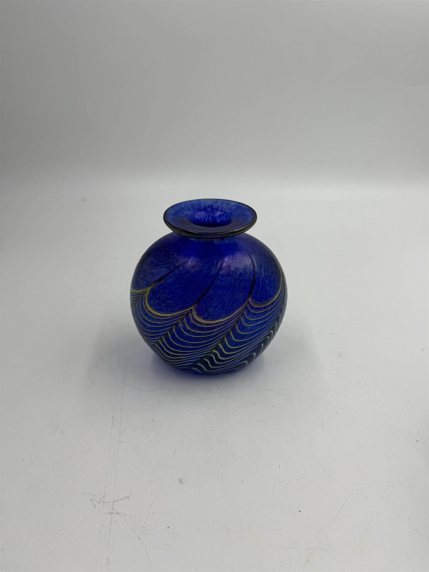 Robert Held glass vase, decorated with iridescent threads and pulls over a blue ground, together with glass vase of squat square form, tallest H10cm, both with original boxes 