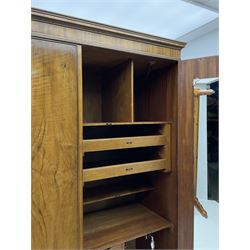 Waring and Gillow - early to mid 20th century figured walnut Gentleman’s wardrobe, two doors enclosing various compartment, mirror, drawers and hanging space, labelled 