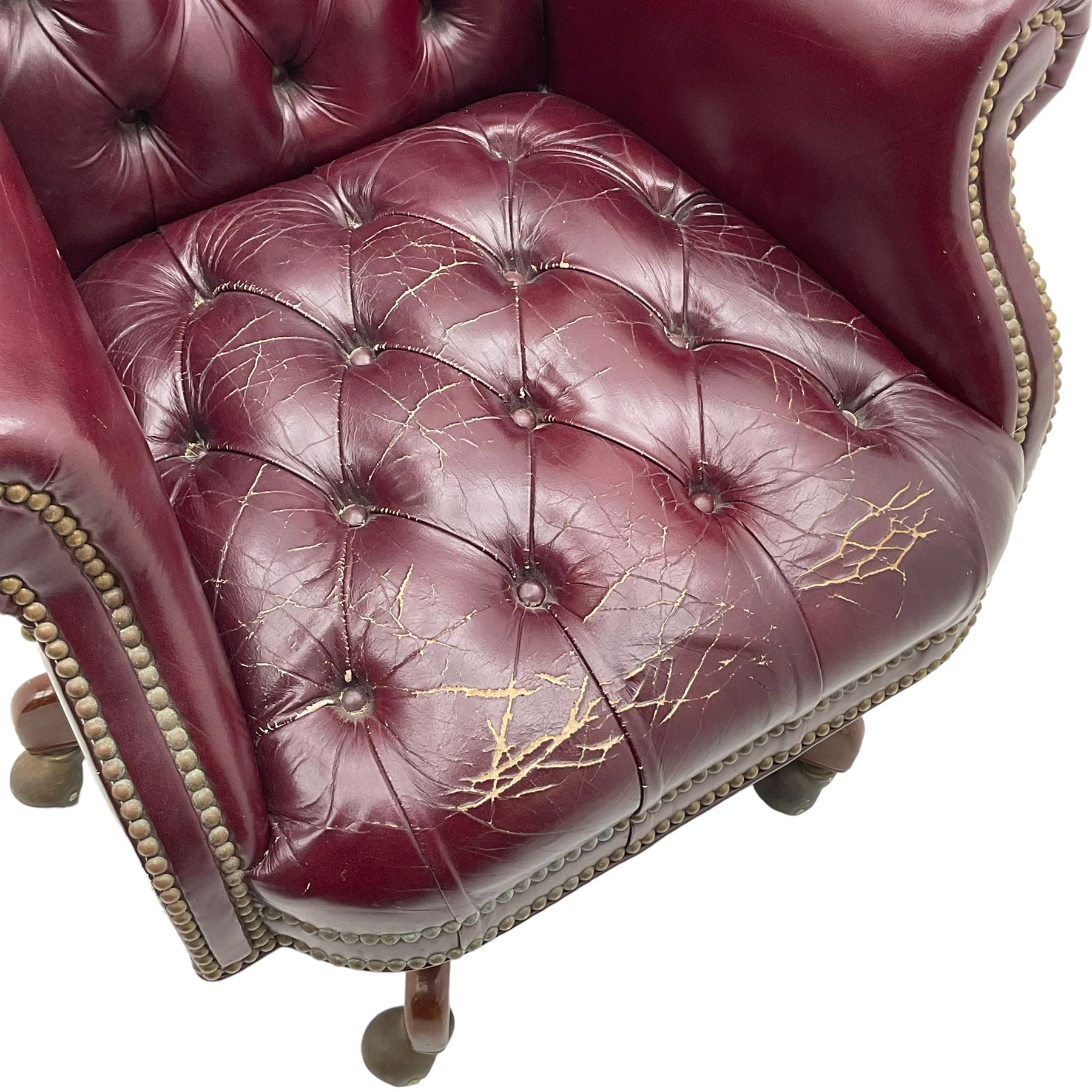 Hancock & Moore - swivel office desk chair, upholstered in buttoned burgundy leather with studded bands, five-spoke base on castors