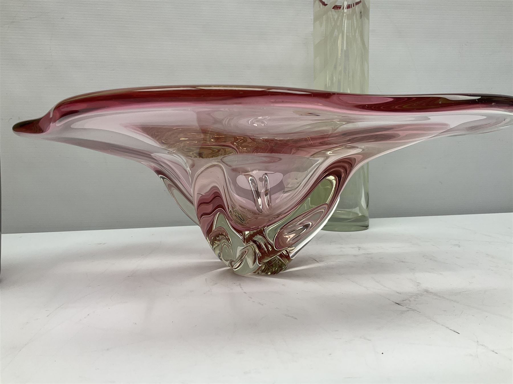 Two Whitefriars glass jugs, together with a Swedish Pukeberg art glass vase and three art glass bowls, including large pink example, some signed to base, tallest H30.5cm