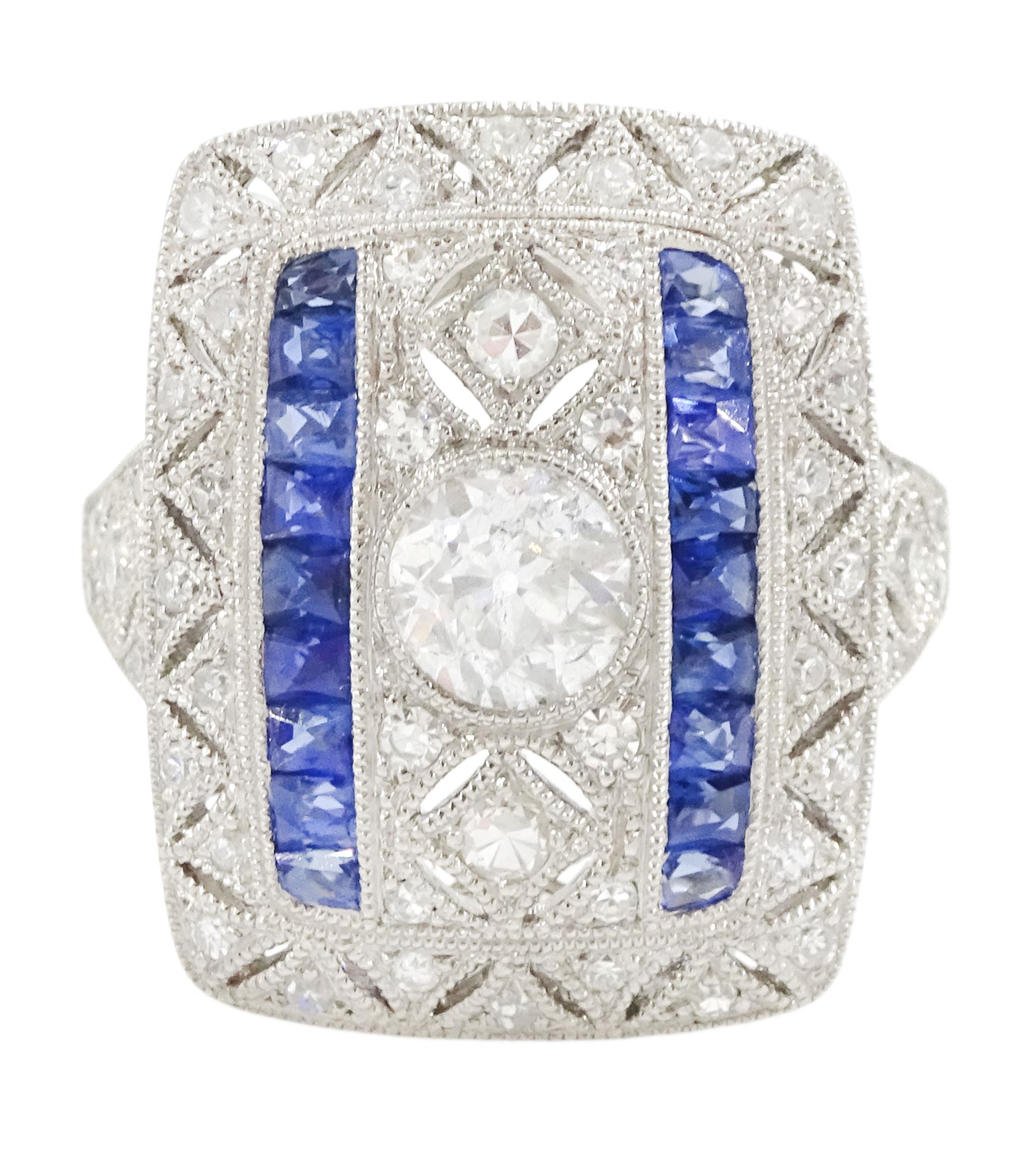 Platinum milgrain set diamond and sapphire ring, the principal old cut diamond of 0.53 carat, with pierced design, single cut diamond and calibre cut sapphire surround, stamped Plat, total sapphire weight 0.30 carat 