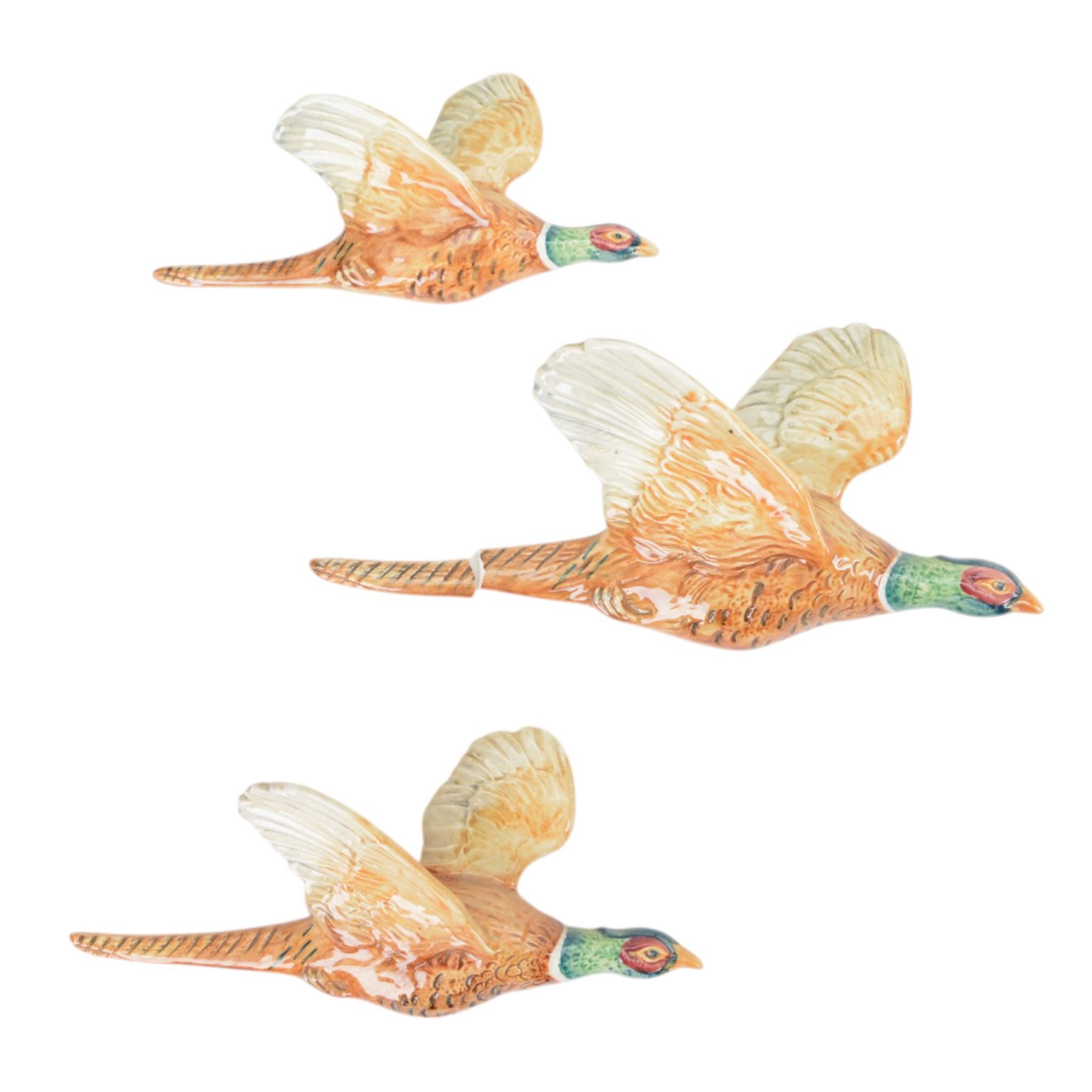 Set of three graduating Beswick pheasant wall plaques, all with printed marks beneath and impressed 661, largest H14cm