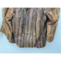 Brown mid length musquash fur coat by National Fur Company together with white rabbit cape