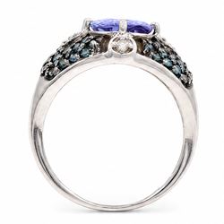 9ct white gold tanzanite and diamond ring, single oval cut tanzanite of approx 1.70 carat, surrounded by four single cut white diamonds and pave set blue diamonds, hallmarked