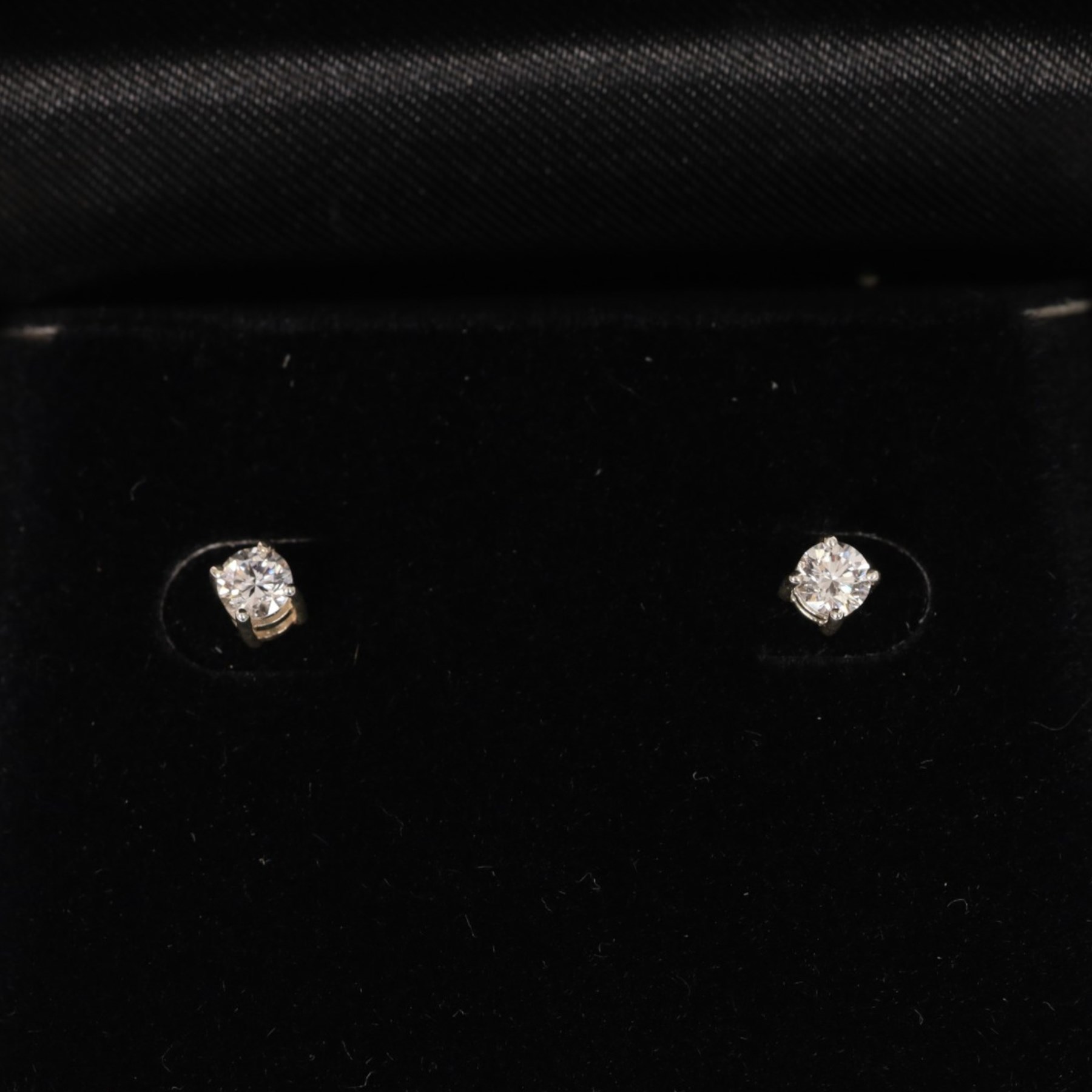 Pair of silver diamond stud earrings, boxed