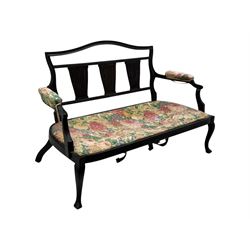 Edwardian mahogany three seater settee, upholstered in floral fabric. Shield back with padded armrests and cabriole legs  