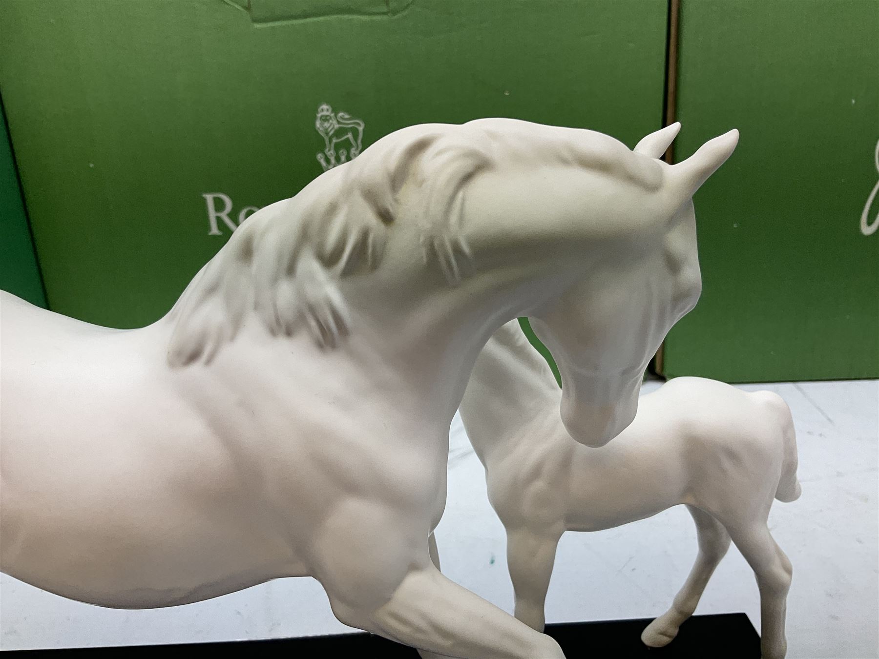 Five Beswick and Royal Doulton horse figures in matt white on black plinths, comprising of  Spirit of Affection no. 2689/2536, Springtime no.2837, Spirit of peace no.2916, Spirit of earth no.2914 and Spirit of the wild no. 183, together with a composite figure of a horse (6)