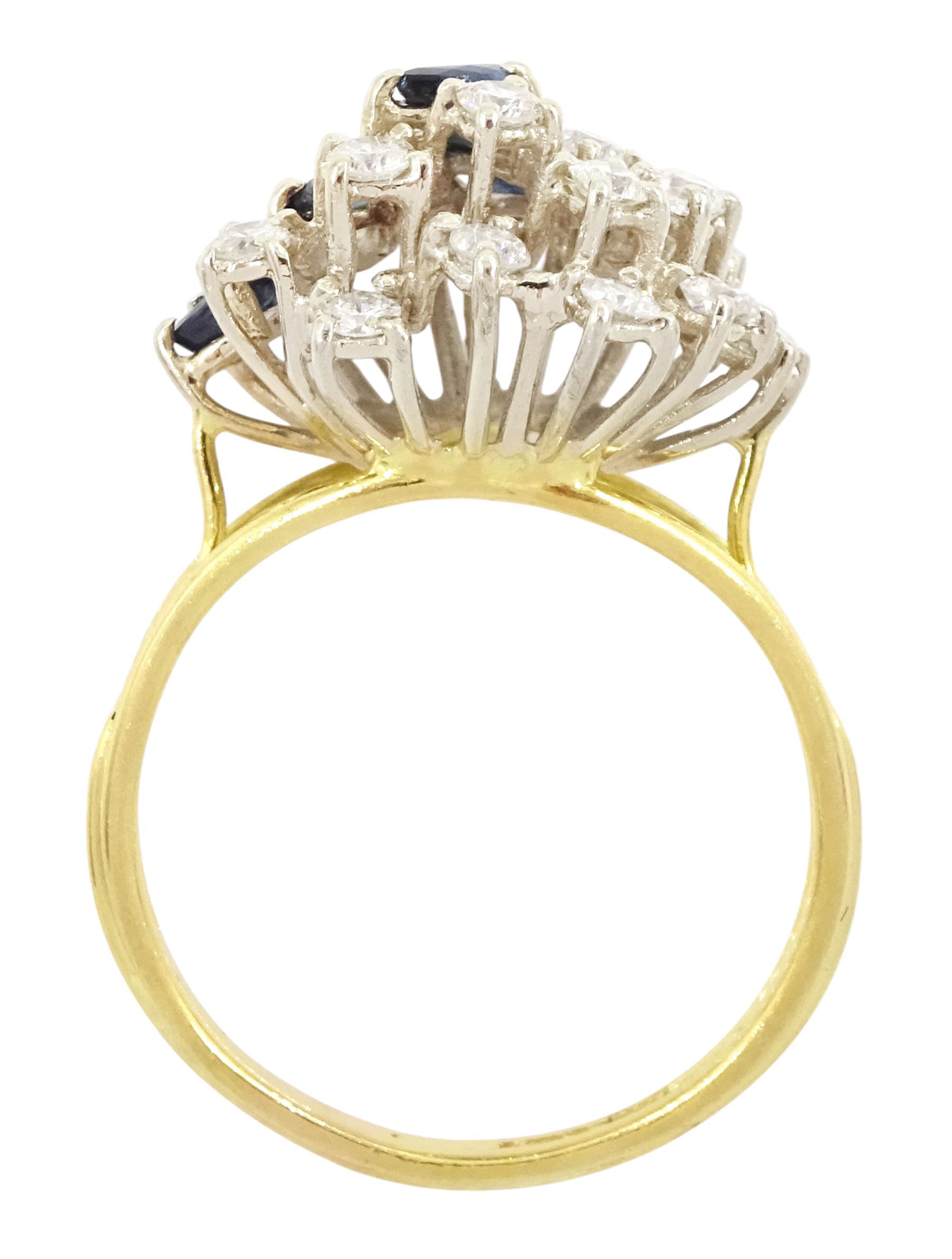 18ct gold sapphire and diamond cluster ring, twelve round brilliant cut diamonds and eight marquise cut sapphires, in a swirl design setting, Sheffield import mark 1989, total diamond weight approx 0.70 carat