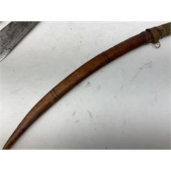 Near pair of African Moroccan Berber tribal Shula daggers each with engraved 39cm curving fullered steel blade, carved and inlaid horn grip and leather covered scabbard L57cm overall; kindjal style dagger with brass covered and jewelled grip and scabbard; another Eastern dagger with leather covered grip and scabbard; and a large Eastern knife with animal hide scabbard (5)