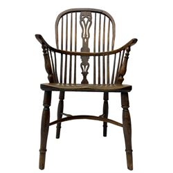 19th century yew wood and elm Windsor chair, high hoop and stick back with pierced splat over dished seat, raised on ring turned supports united by crinoline stretcher