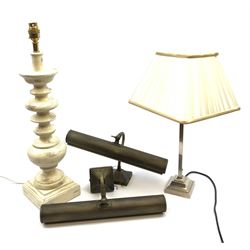 A cream washed effect table lamp, with knopped stem upon a stepped square base, with cream shade, overall H78cm, together with a chrome effect table lamp with pleated cream shade, overall H47cm, and a pair of picture lights. (4). 