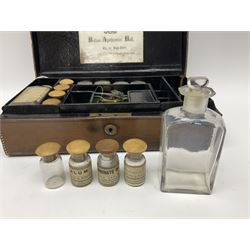 19th century apothecary leather carrying case, with key, the hinged lid opening to reveal seventeen glass medicine bottles with stoppers, most with chemist labels, gram scales, and domestic medicines booklet, H9cm, L27cm