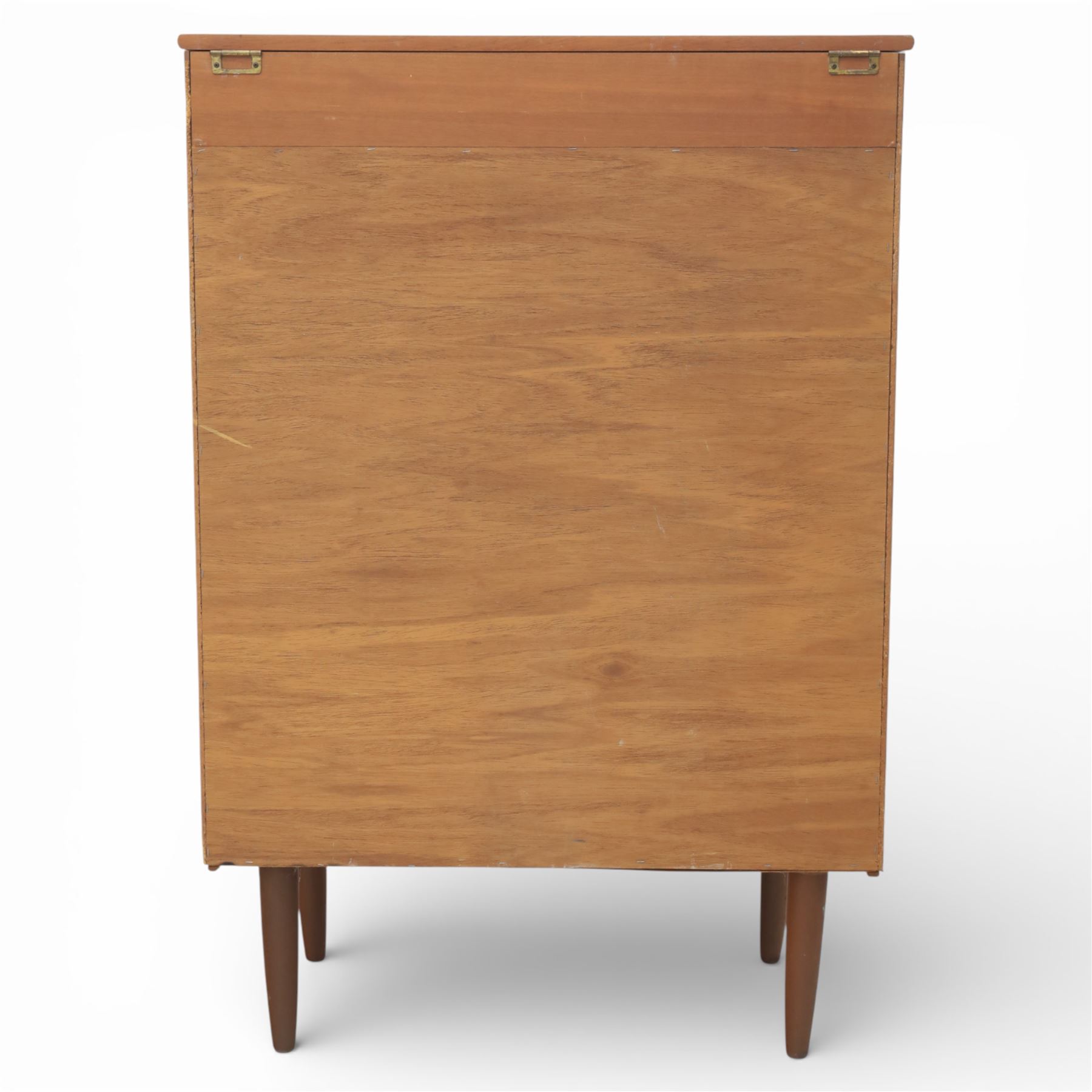 Mid 20th century teak dressing chest, rectangular top hinged to reveal a fitted interior with divisions and a rectangular mirror to the underside, over five long drawers with recessed circular handles, raised on tapering supports