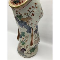Large Japanese Imari porcelain figure, modelled as a Bijin, wearing a long kimono decorated with apple blossom and leafy branches on a white ground, with gilt detailing, possibly Edo period, H63cm