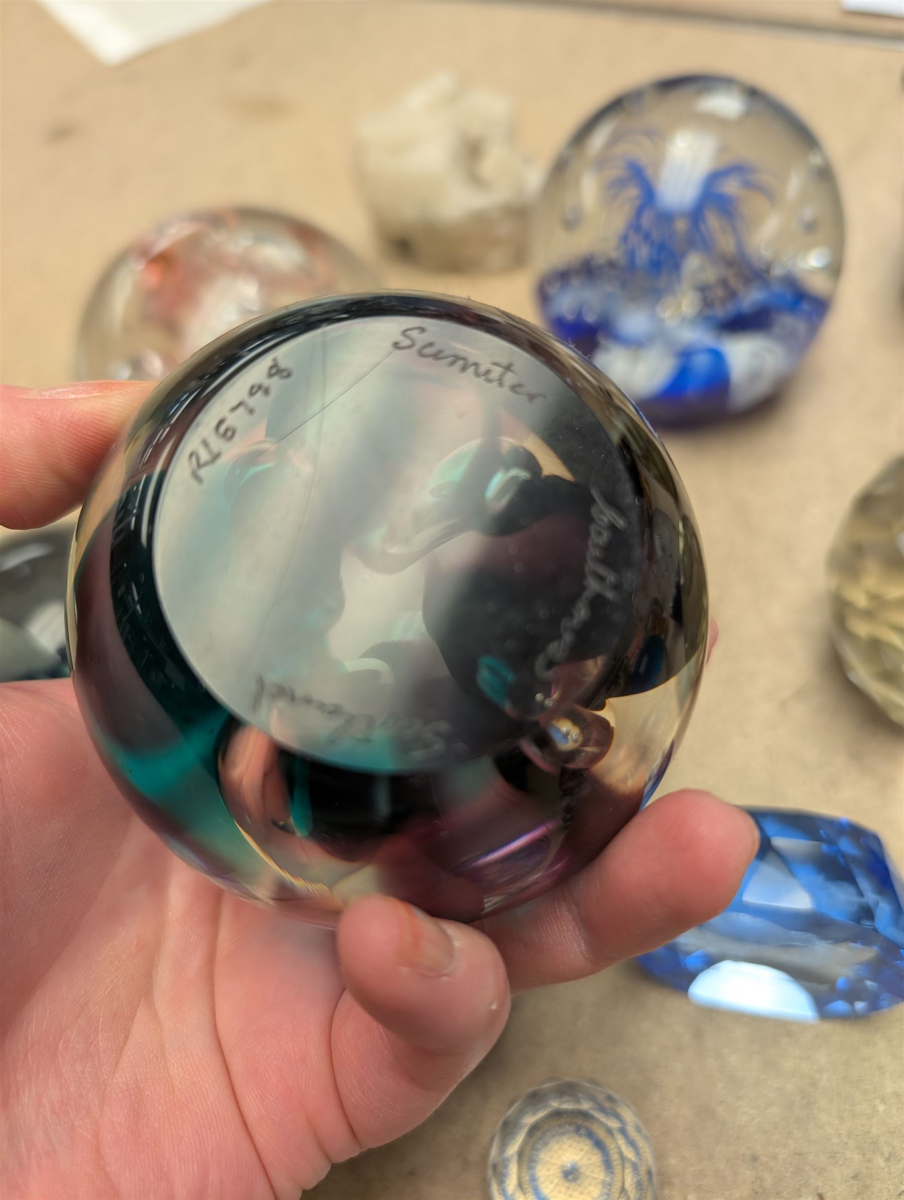 Collection of glass paperweights, including Caithness and Selkirk Glass