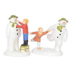 Five Coalport The Snowman figures, comprising Adding a Smile, Walking in the Air, Snowman's Surprise, The Adventure Begins and The Hug, three boxed